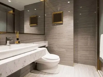 Modern renovated bathroom with tiled walls and a fitted shower