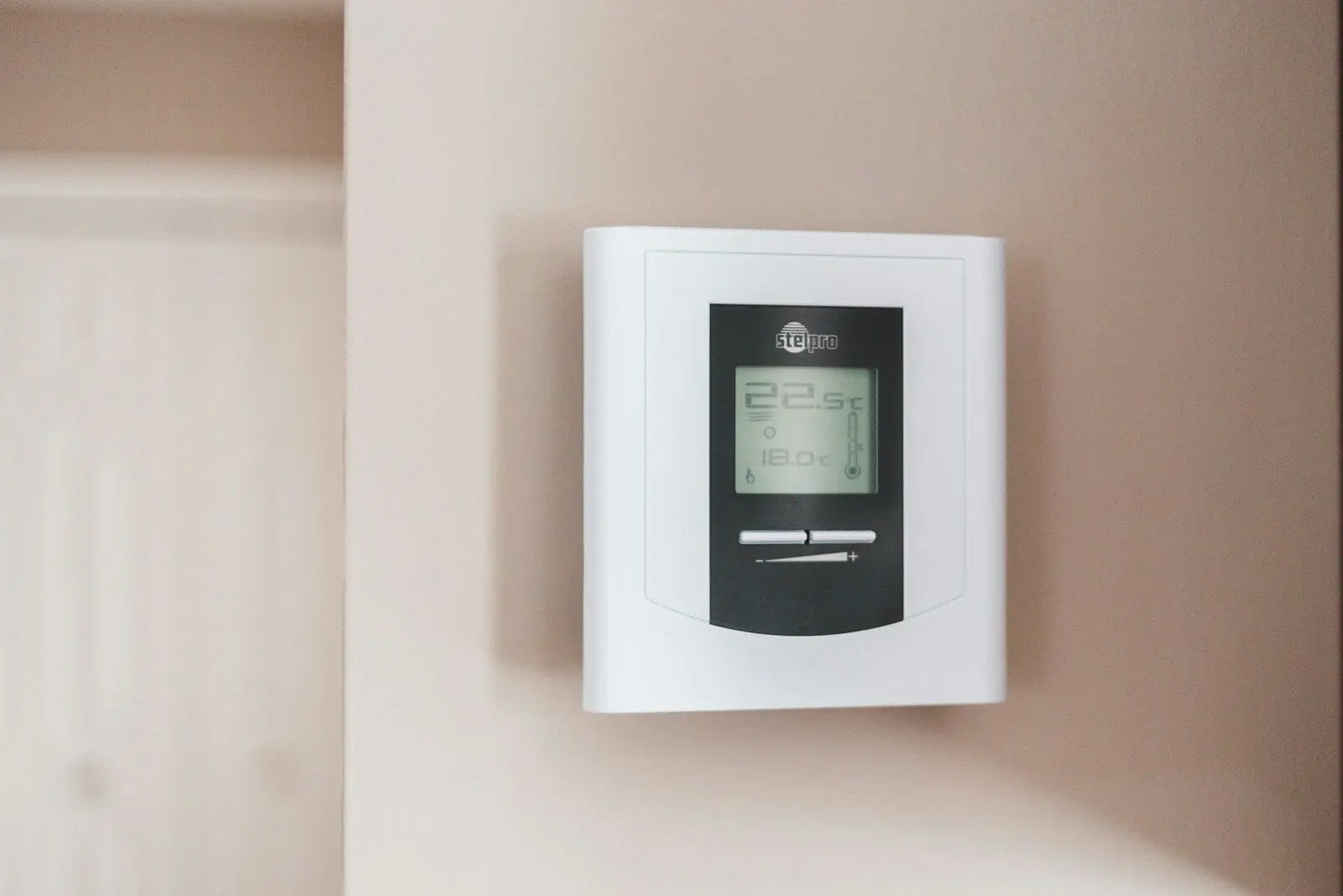 Photo by Erik Mclean white and gray thermostat at 19 5