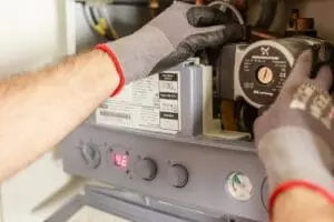 Plumber working on a boiler in a Doncaster home