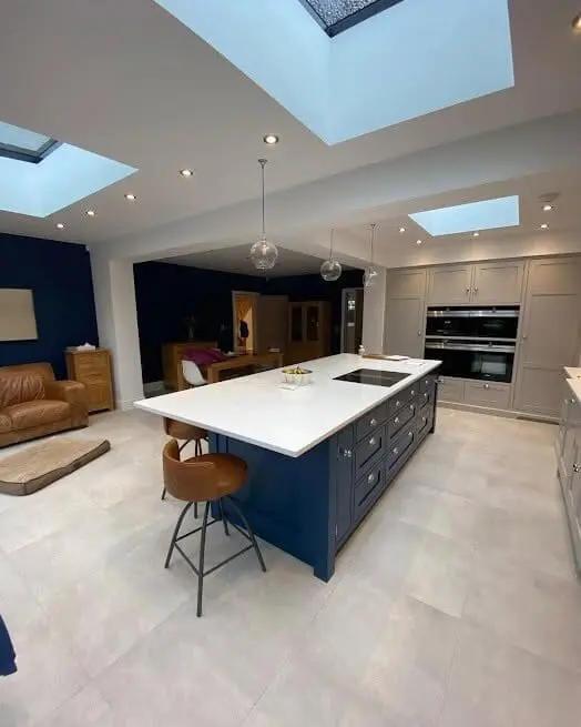 Open-plan navy kitchen renovation with island and skylights in Sheffield by Heat365
