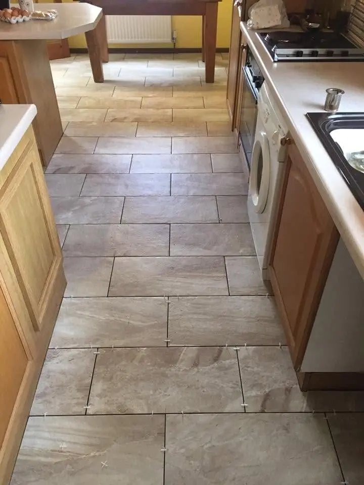 Kitchen floor tiling during a renovation in Sheffield by Heat365