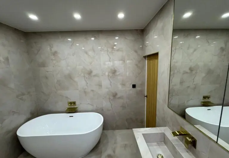 Bathroom renovation in Sheffield with a freestanding bath and full-height tiling