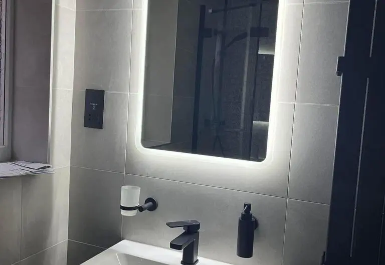 Navy vanity unit and LED mirror fitted by Heat365 in a Sheffield bathroom