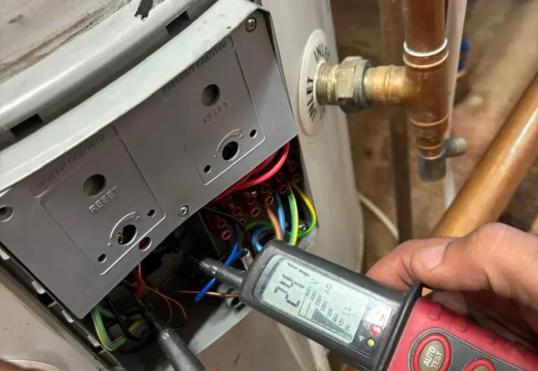 Heat365 engineer testing a boiler’s electrical connections with a multimeter while diagnosing a fault in Sheffield