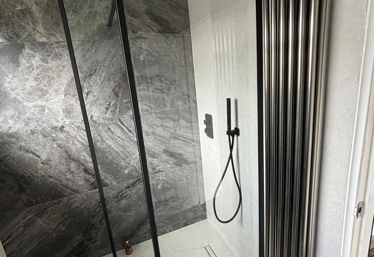 Black designer vertical radiator supplied and fitted by Heat365 in Sheffield