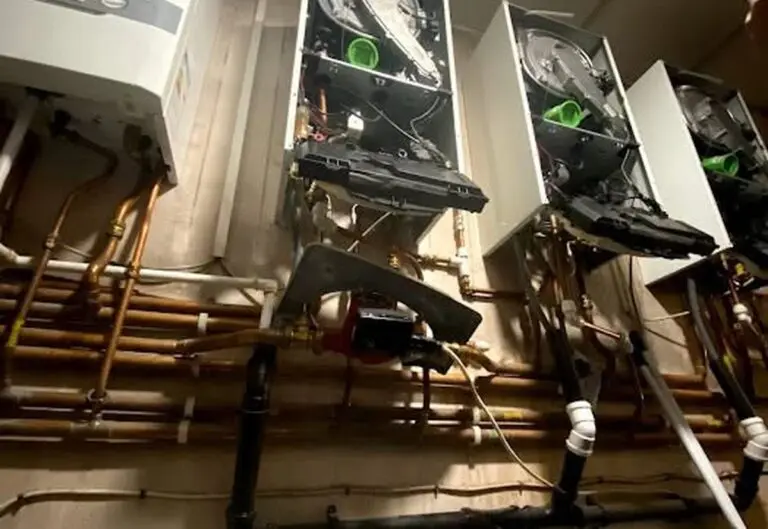 Heat365 engineer working on boiler pipework during an emergency callout in Sheffield