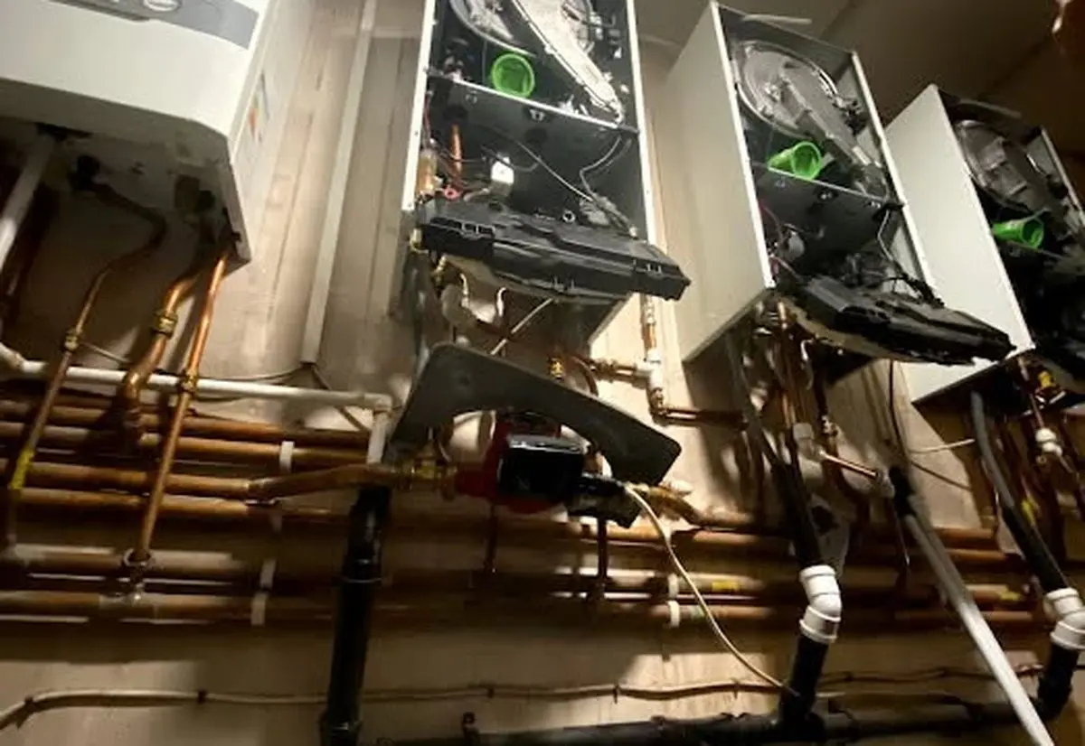 Heat365 engineer working on boiler pipework during an emergency callout in Sheffield